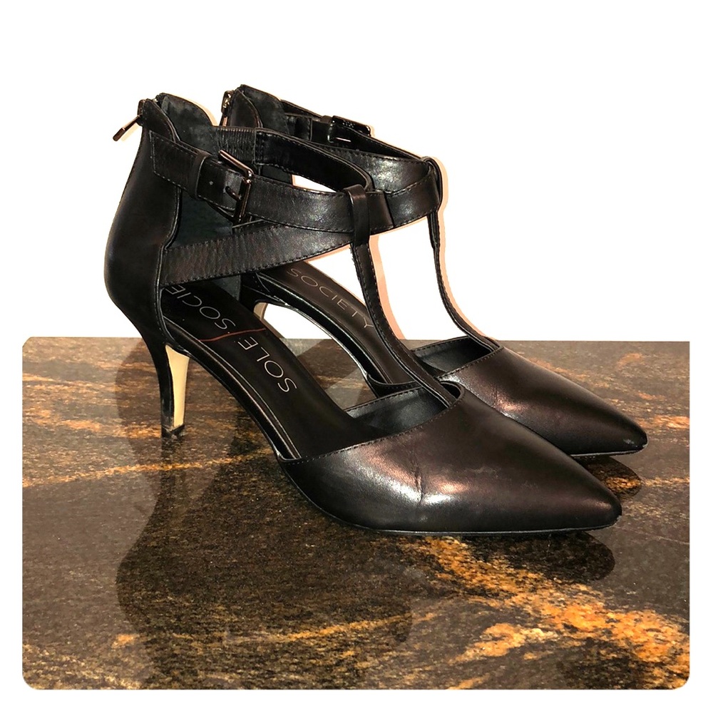 Black pointed toe pumps